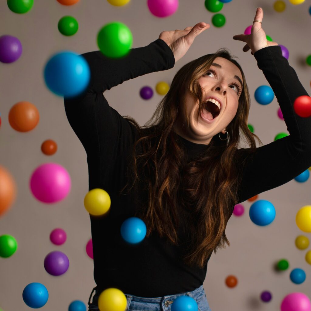 picture of women amongst many falling balls
